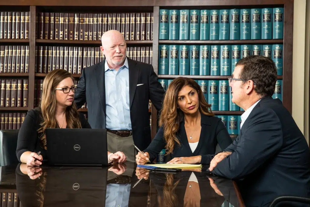 Viola law attorneys having a discussion at a table