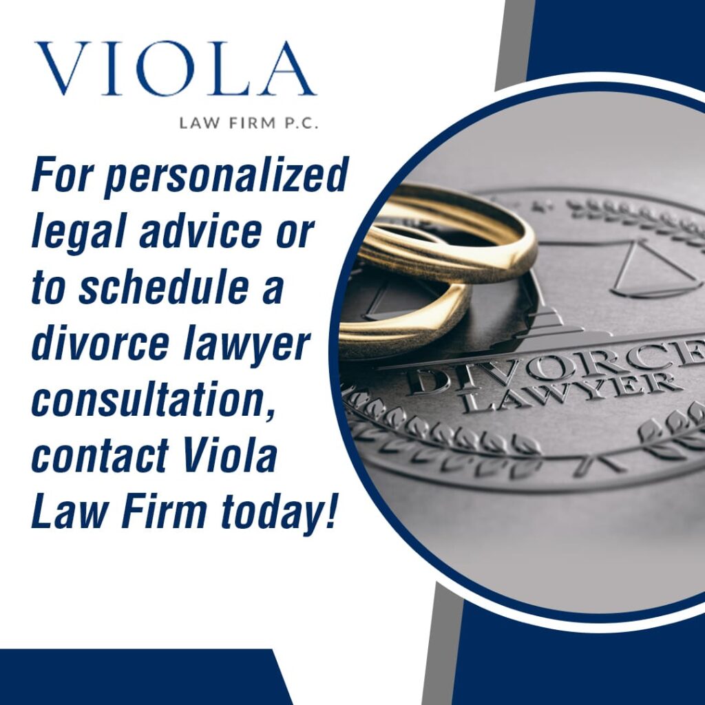 Close-up of two wedding rings on a silver emblem that says 'DIVORCE LAWYER'.