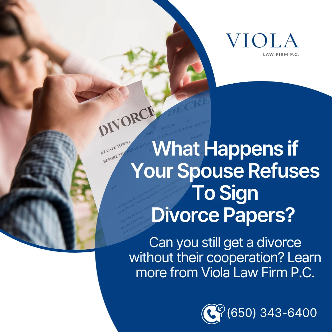 Hands tearing a divorce decree document while a woman looks on, featured on a graphic by Viola Law Firm.