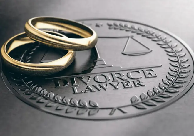 Legal seal marked “Divorce Lawyer” with scales of justice and two gold wedding bands representing divorce and family law matters.